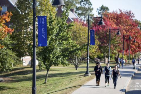 students on unh campus main st banners